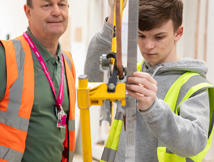 Students learning about plumbing