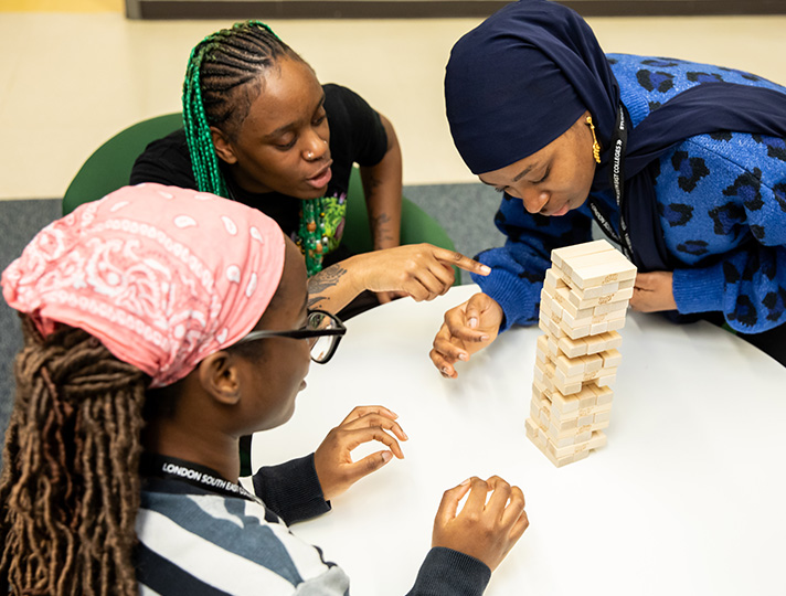 Students playing jenga